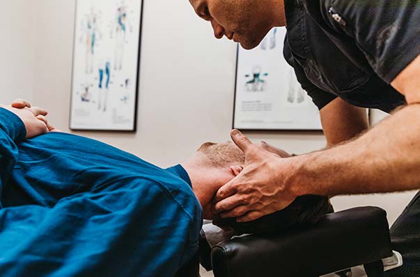 Chiropractor Portland OR Dr. Daniel Capitano Adjusting Patient