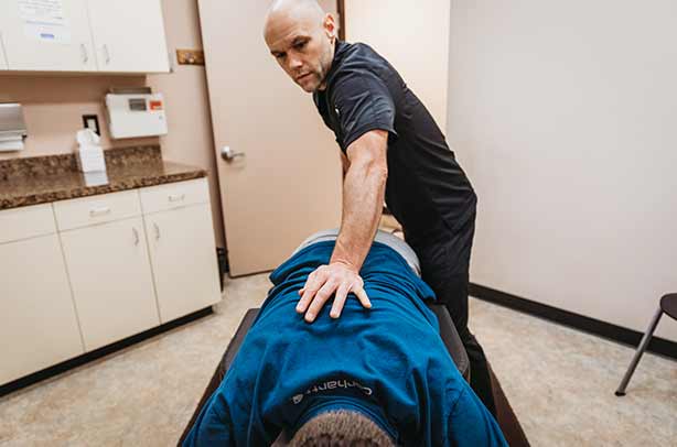Chiropractor Portland OR Dr. Daniel Capitano Adjusting Patient